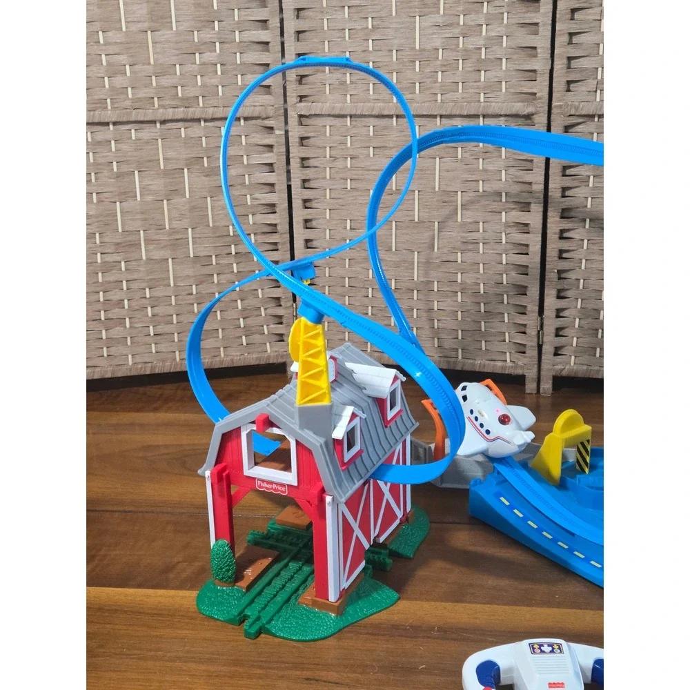 Fisher-Price GeoTrax Breakthrough Barn and High-Flying Airport RC Plane Bundle